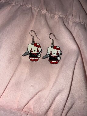Hello kitty as billy from saw earrings